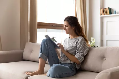 woman reading in notebook